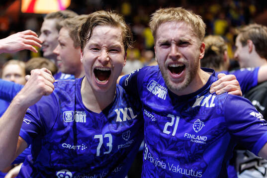 Justus Kainulainen and Heikki Iiskola of Finland celebrate