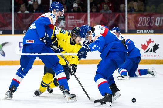 Miroslav Satan and Jakub Chromiak of Slovakia against Oskar