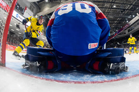 David Edstrom of Sweden and goaltender Samuel Urban of