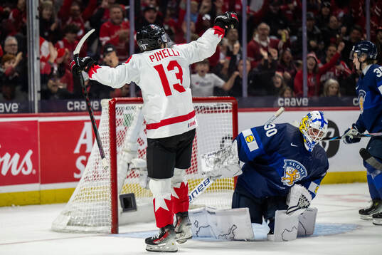 Luca Pinelli of Canada celebrates
