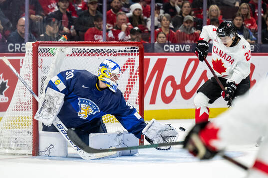 goaltender Petteri Rimpinen of Finland and Tanner Howe of