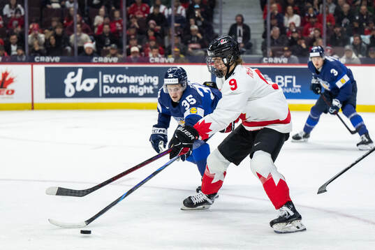 Arttu Tuhkala of Finland and Gavin McKenna of Canada