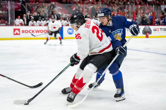 Cole Beaudoin of Canada and Konsta Helenius of Finland