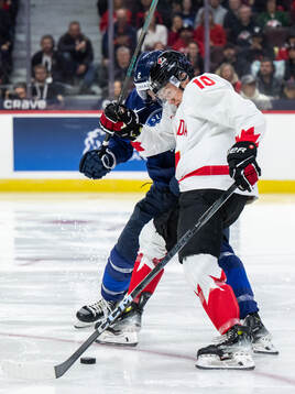 Mitja Jokinen of Finland and Bradly Nadeau of Canada