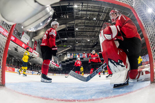 Eric Schneller and goaltender Christian Kirsch of