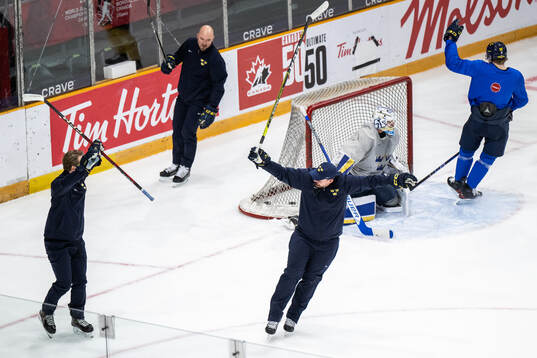 Goaltender coach Viktor Alm and assistant coach Gereon