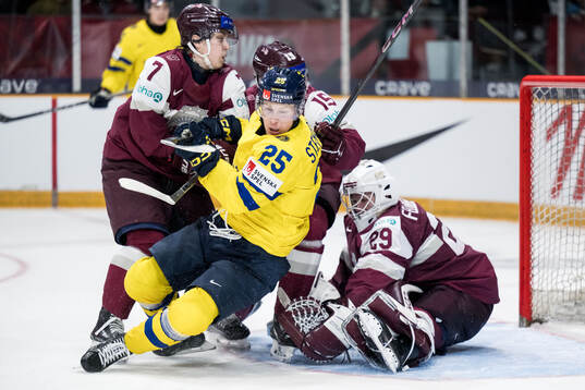 Davids Livsics, Darels Uljanskis and goaltender Linards