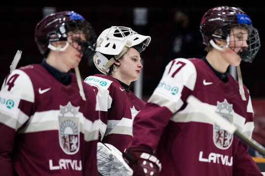 Goaltender Linards Feldbergs of Latvia looks dejected