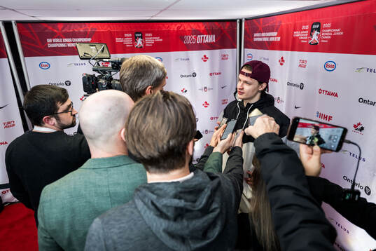 Goaltender Linards Feldbergs of Latvia in mixed zone