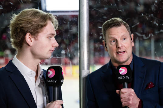 Goaltender Melvin Strahl of Sweden and Niklas Jihde of