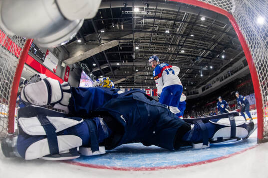Goaltender Petteri Rimpinen of Finland with a save against