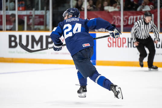 Jesse Nurmi of Finland celebrates