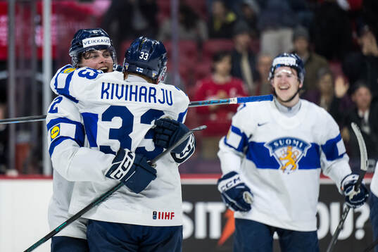 Mitja Jokinen and Aron Kiviharju of Finland celebrate
