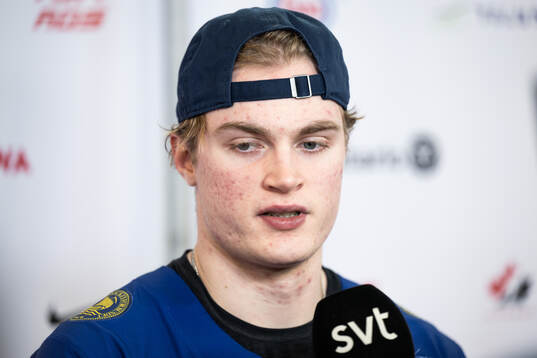 Tom Willander of Sweden is interviewed in the mixedzone