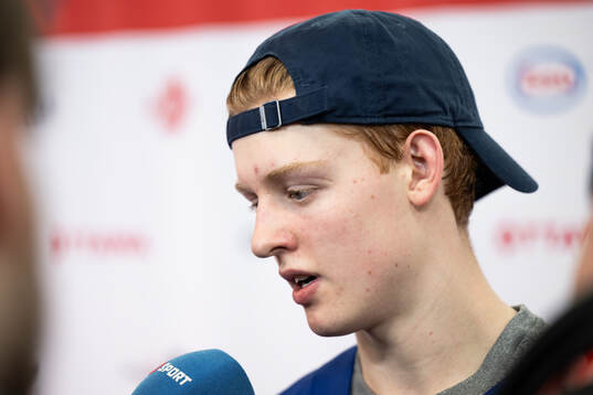 Viggo Gustafsson of Sweden is interviewed in the mixedzone