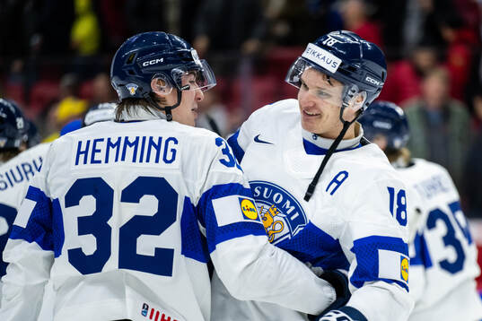 Emil Hemming and Rasmus Kumpulainen of Finland celebrate
