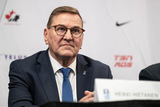 Heikki Hietanen council member of IIHF at a IIHF press