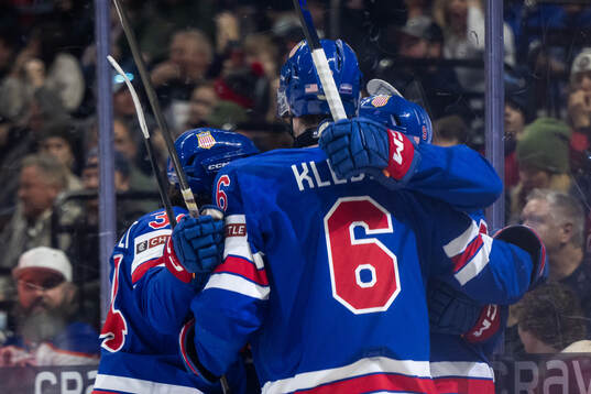 James Hagens of USA celebrates with team mates