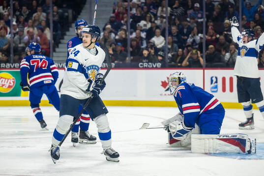 Jesse Nurmi of Finland celebrates