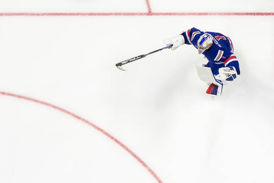 Goaltender Trey Augustine of USA celebrates