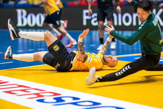Andreas Nilsson of Sweden and goalkeeper Takumi Nakamura of