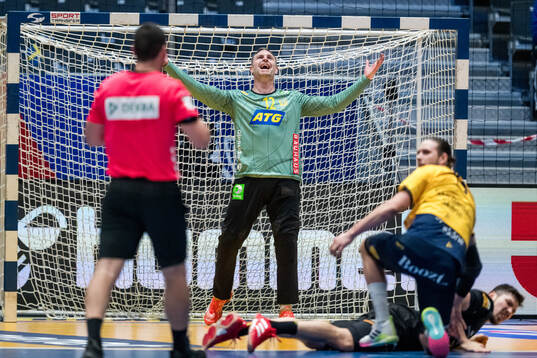 goalkeeper Andreas Palicka of Sweden reacts