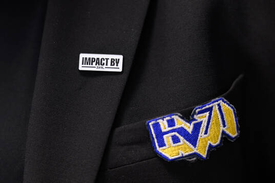 En pin för Impact by SHL