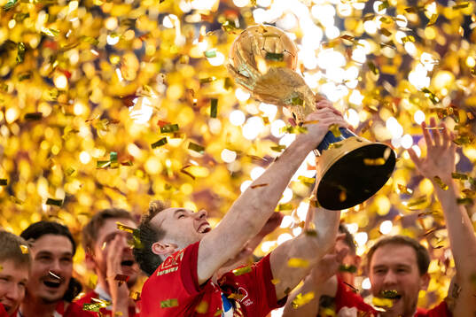Mathias Gidsel of Denmark celebrates with the trophy