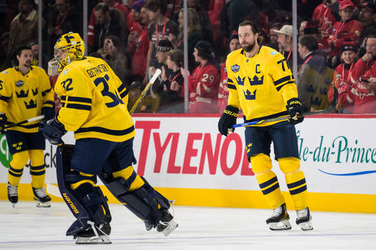 Goaltender Filip Gustavsson and Victor Hedman of Sweden at