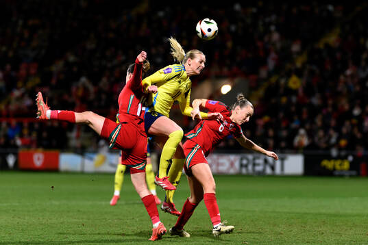 Hayley Ladd and Josie Green of Wales against Stina