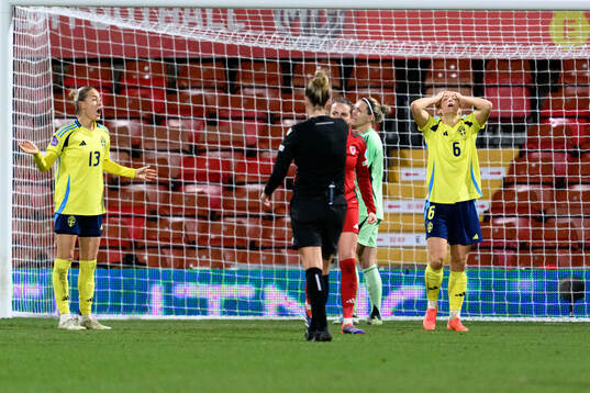 Emma Kullberg and Magdalena Eriksson of Sweden look dejected