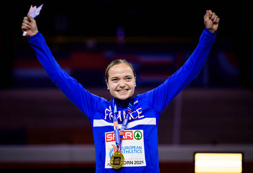 Agathe Guillemot of France with her gold medal at the medal