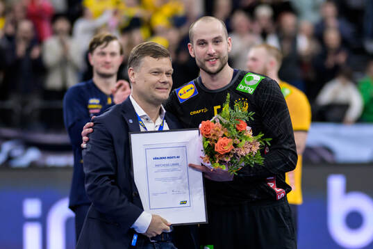 Goalkeeper Fabian Norsten of Sweden is awarded player of