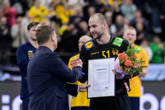 Goalkeeper Fabian Norsten of Sweden is awarded player of