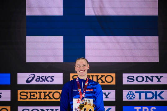 Saga Vanninen of Finland celebrates at the podium