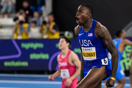Grant Holloway of USA celebrates winning in men’s 60