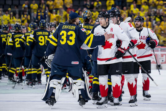 Goaltender Samuel Ersson of Sweden and Nathan MacKinnon of