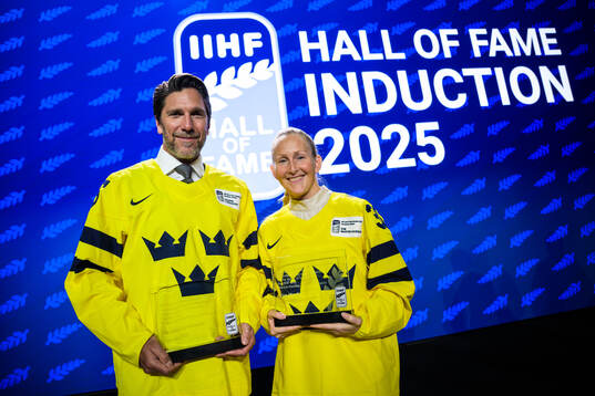 Henrik Lundqvist and Kim Martin-Hasson of Sweden pose with