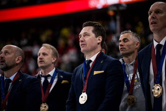 Head coach Sam Hallam with his bronze medal
