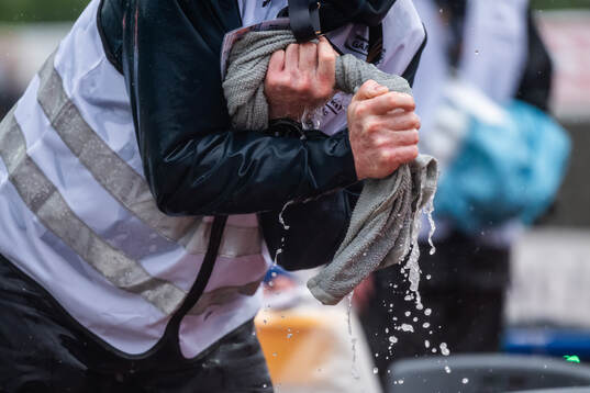 A volunteer with a towel