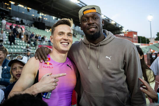 Karsten Warholm of Norway celebrates with Usain Bolt