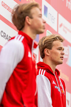 Simen Guttormsen and Sondre Guttormsen at the podium