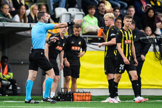 Referee Georgi Kabakov points to the penalty point