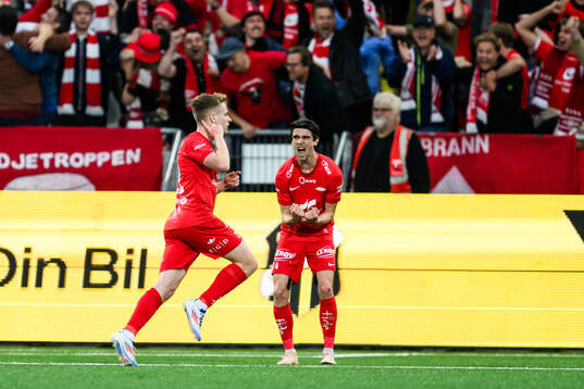 Saevar Atli Magnusson and Ulrik Mathisen of Brann celebrate