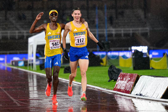 Suldan Hassan and Andreas Almgren of Sweden celebrate