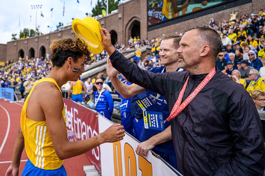 Melwin Lycke Holm of Sweden celebrate with coach Stefan Holm