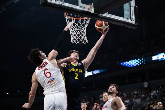 Cedi Osman of Turkey and Adam Ramstedt of Sweden