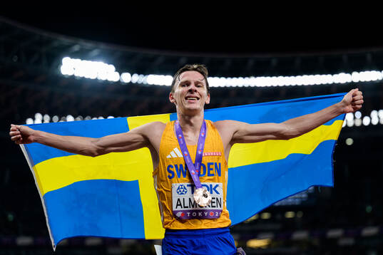 Andreas Almgren of Sweden celebrates third place in men's