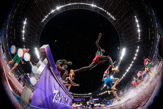 Athletes compete in men's 3000 meters steeplechase final
