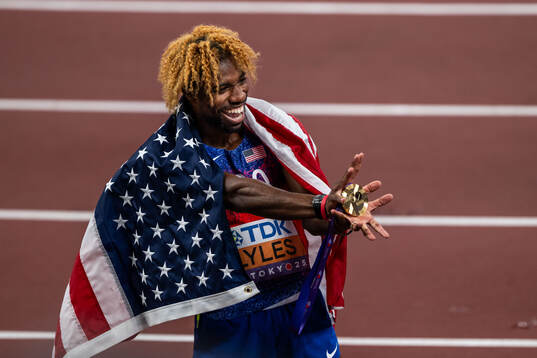 Noah Lyles of USA celebrates